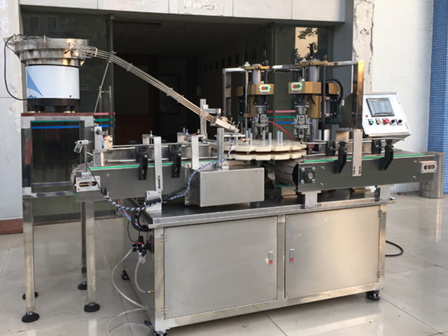 capping machine with 2 capping heads urządzenie do zamykania śrub półautomatyczne.jpg